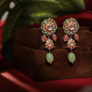 Delicate stud earings with pastel green drops