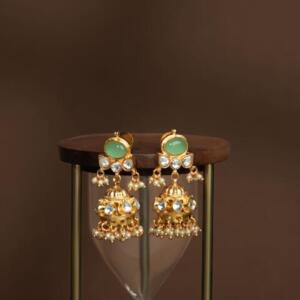 gold-toned jadtar jhumki earrings with green stones and pearl drops