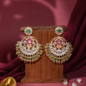 Royal gold-plated kundan chandbali earrings adorned with pearls and beads