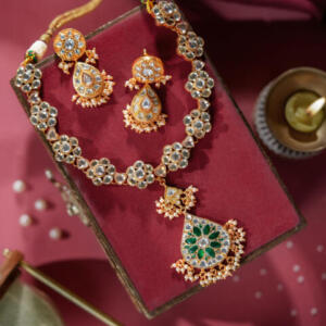 gold plated green necklace set with green stones and pearls