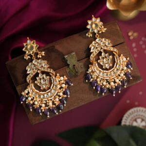 traditional Indian gold-plated Chaandbali earrings featuring intricate Jadau Kundan work, pearls, and green and purple gemstone beads