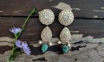 Choker set studded with jadtar stones beadded with pearl and sea green beads
