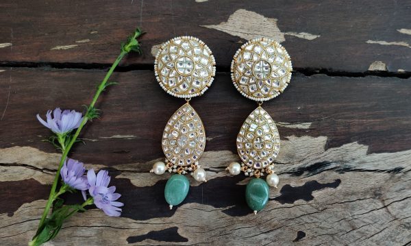 Choker set studded with jadtar stones beadded with pearl and sea green beads