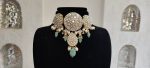 Choker set studded with jadtar stones beadded with pearl and sea green beads