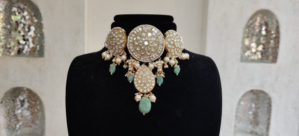 Choker set studded with jadtar stones beadded with pearl and sea green beads