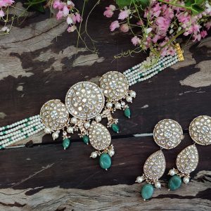 Choker set studded with jadtar stones beadded with pearl and sea green beads